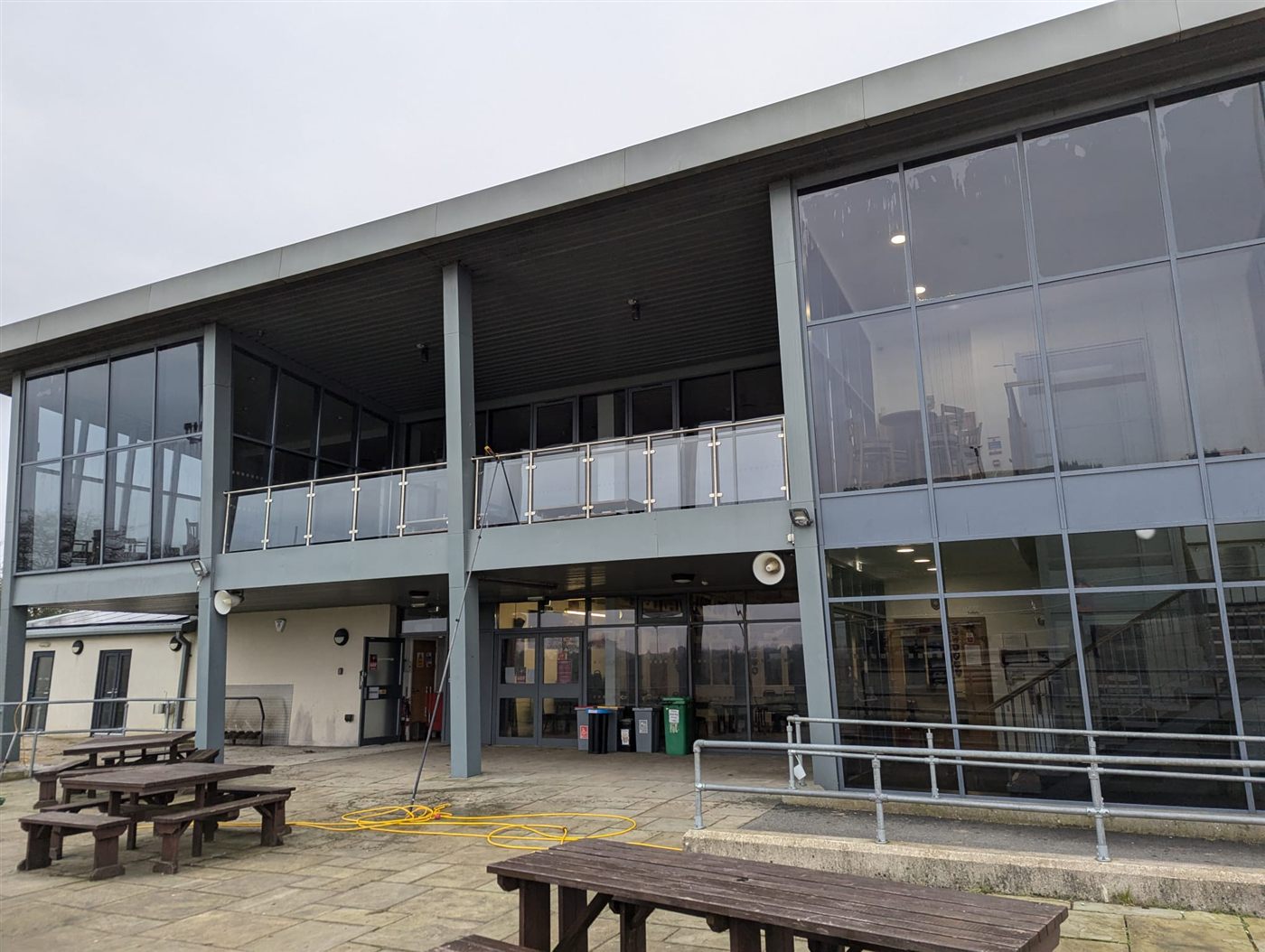 Large exterior glass elevation cleaned from ground level with a long-reach pole