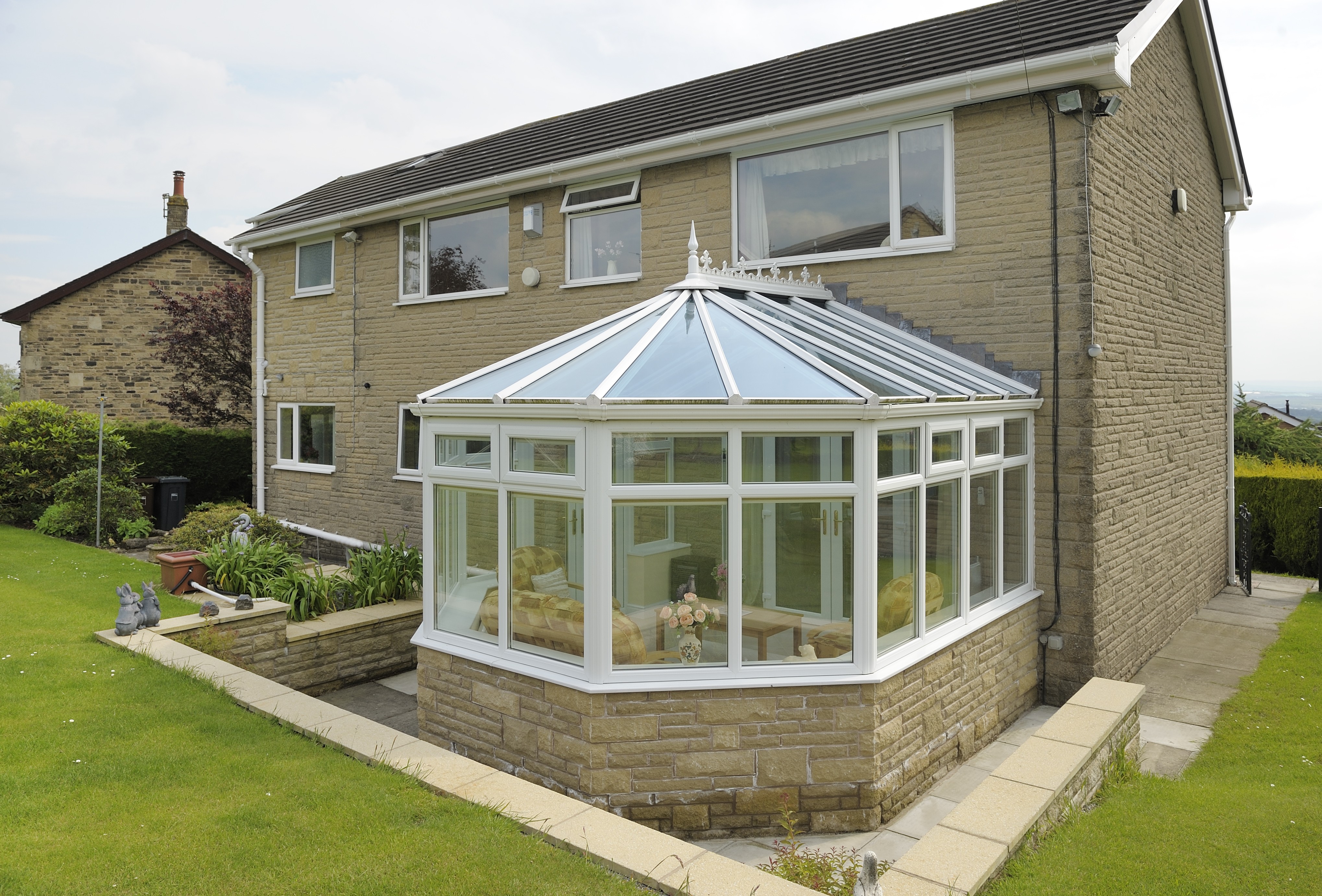 Freshly cleaned conservatory with clear glass and bright roof panels